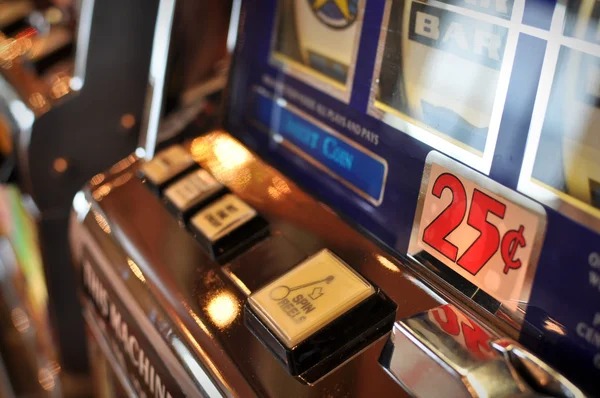 Mobile phone showing joinbola Mega Moolah slot game with jackpot counter and spin button
